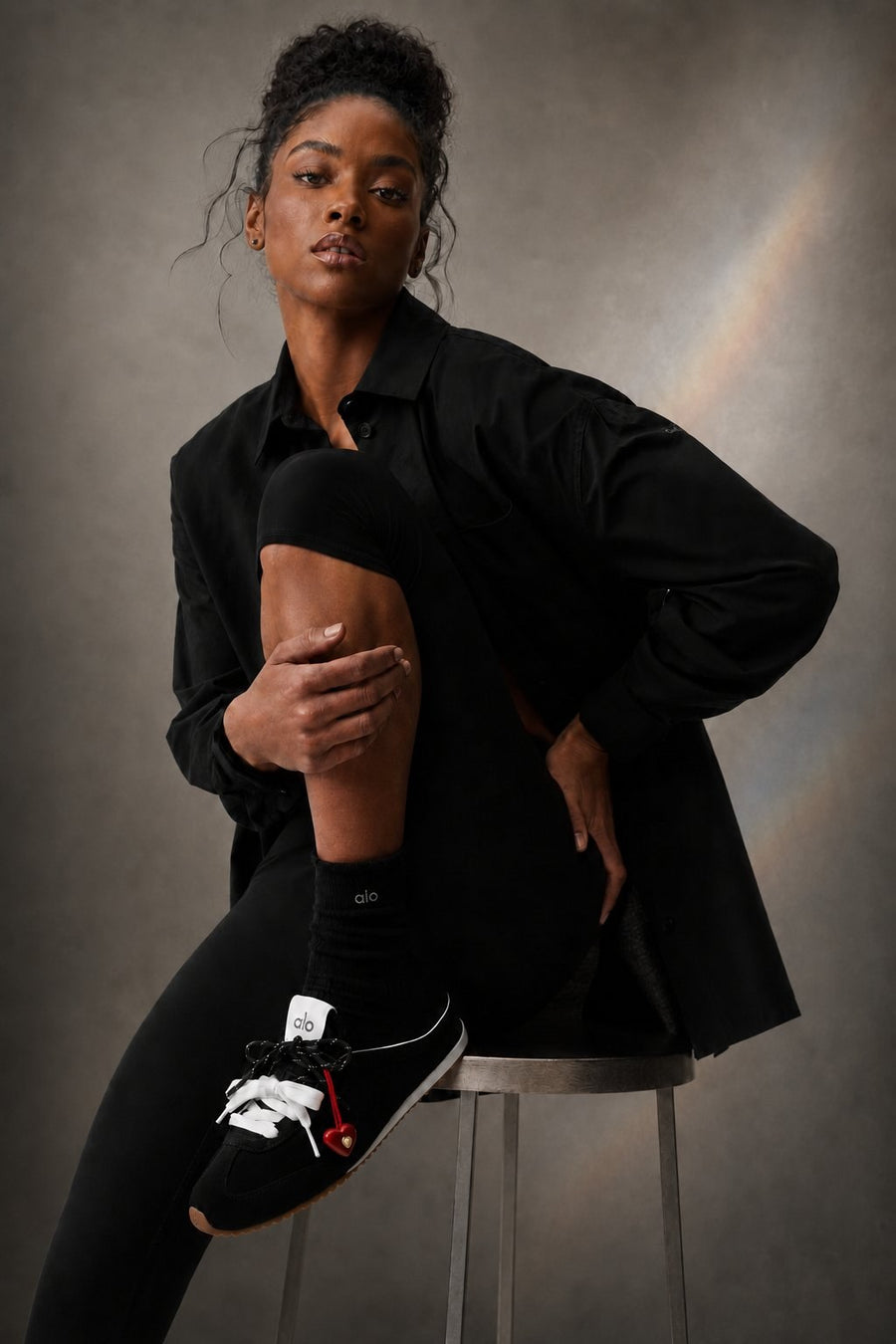 SOVA charm worn on sneaker laces — FW26 editorial.