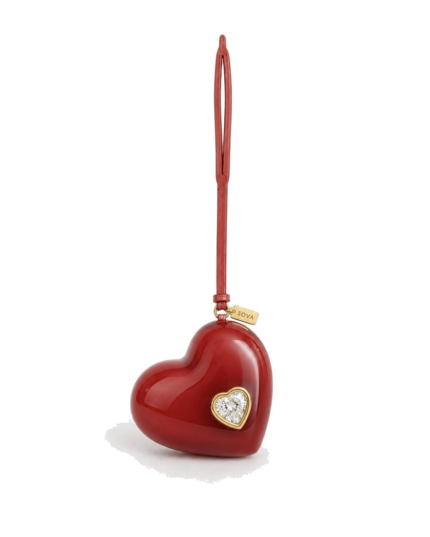 SOVA heart bag charm — heart-cut lab-grown diamond in 18K gold bezel.